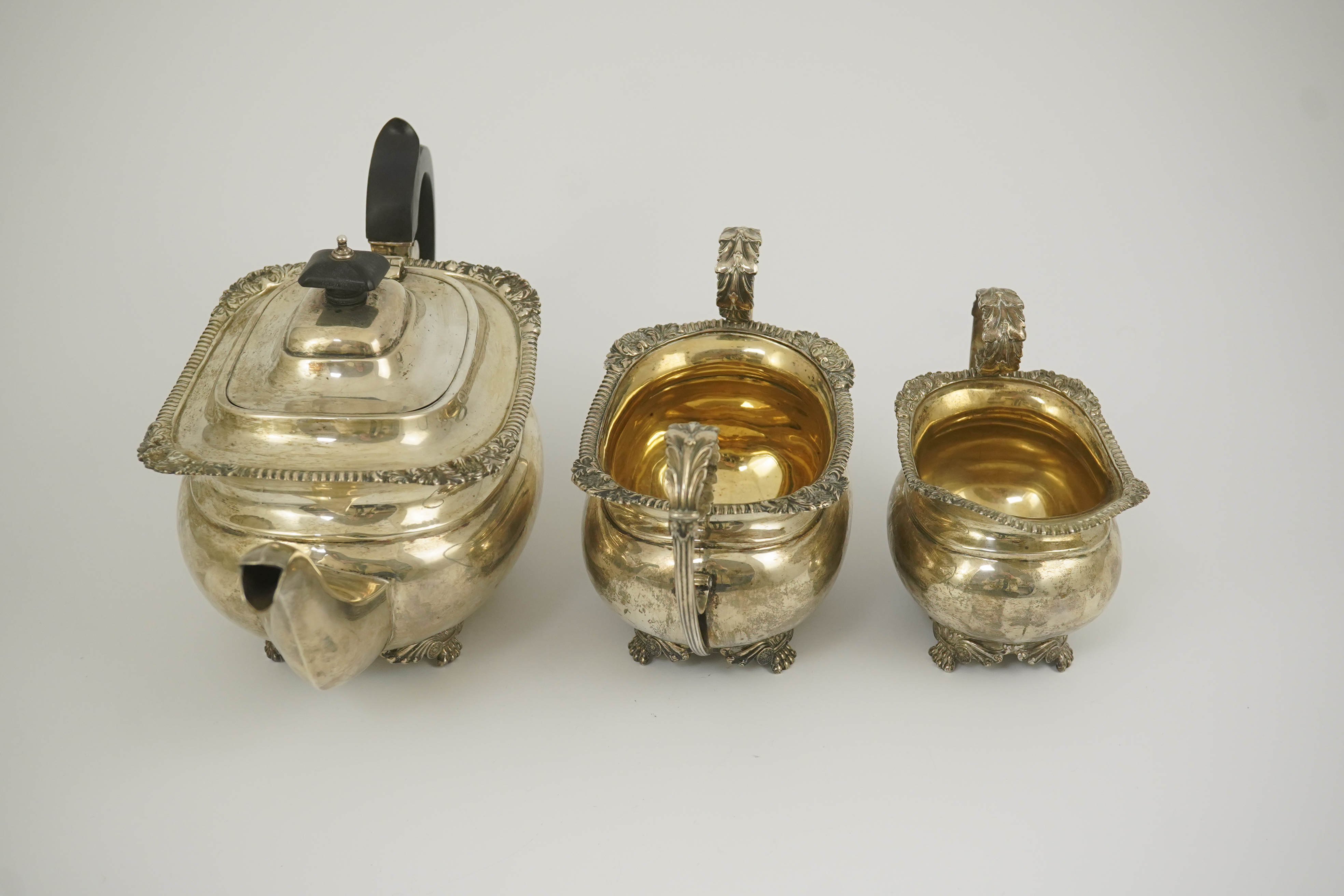 A George V silver three piece tea set by Edward Barnard & Sons Ltd